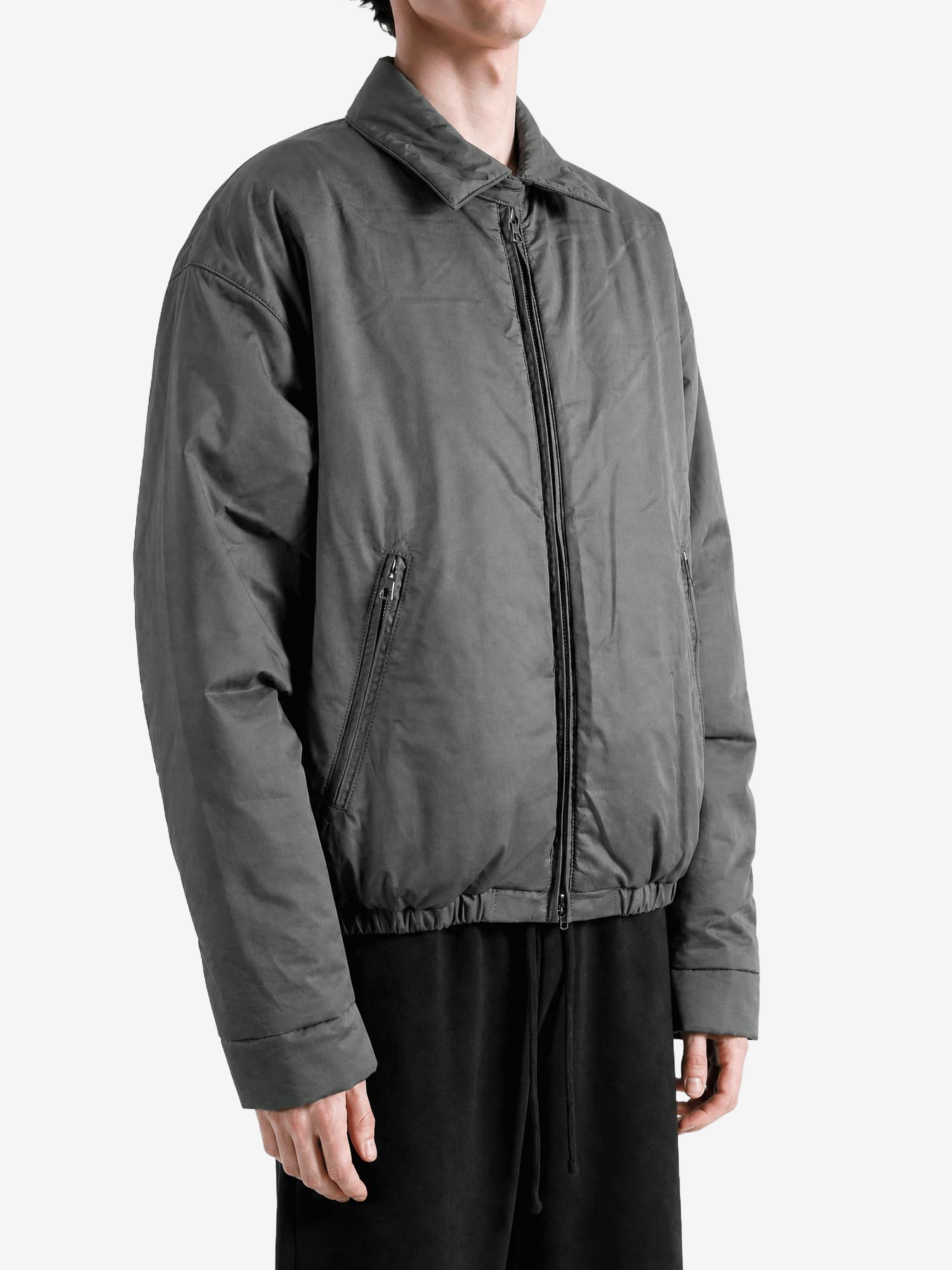 Grey jacket worn by a person, showing the jacket fit