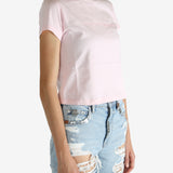 Pink t-shirt worn by a person, showing the shirt's fit