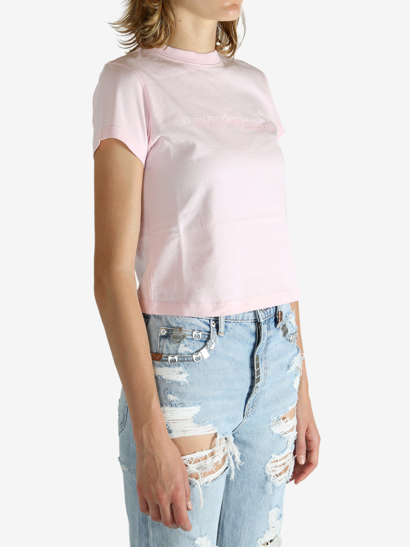 Pink t-shirt worn by a person, showing the shirt's fit