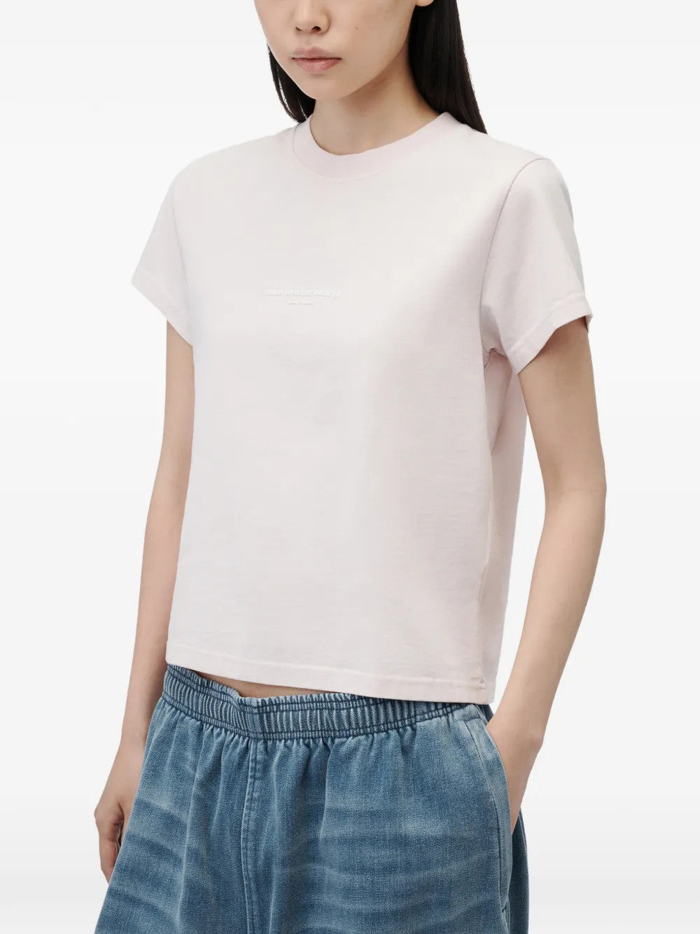 Pink t-shirt worn by a person, showing the t-shirt fit
