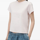 Pink t-shirt worn by a person, showing the t-shirt fit