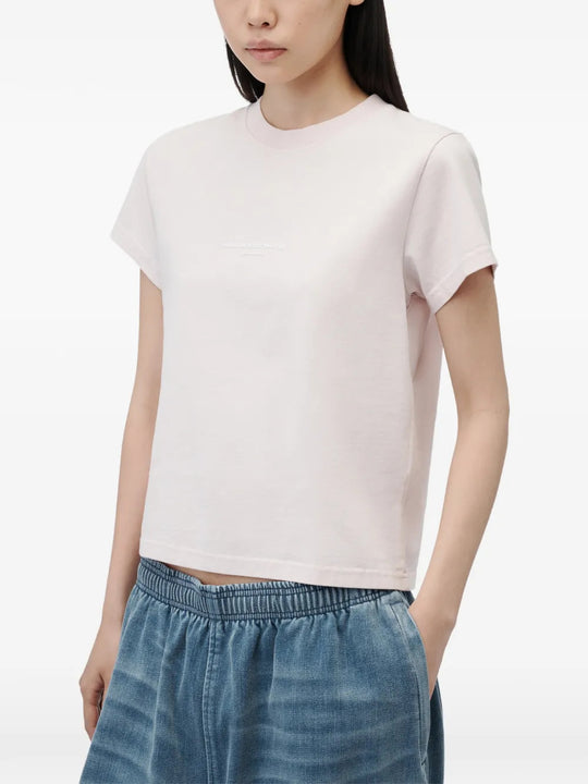 Pink t-shirt worn by a person, showing the t-shirt fit