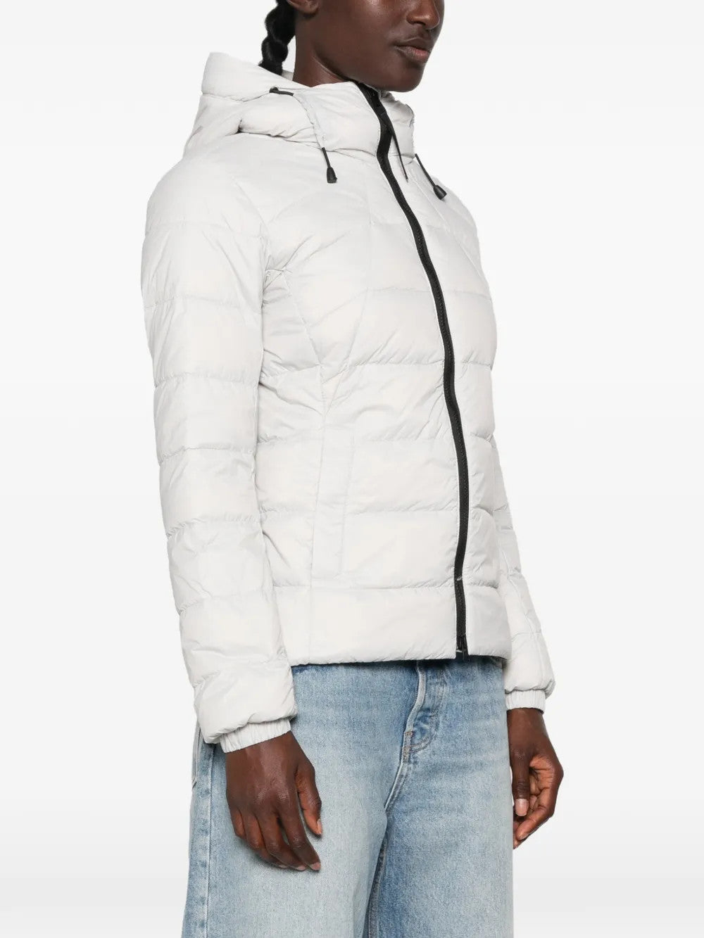 White hoodie worn by a person, showing the hoodie fit