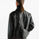 Brown bag worn by a person, showing the bag fit