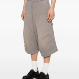 Grey shorts worn by a person, showing the shorts' fit