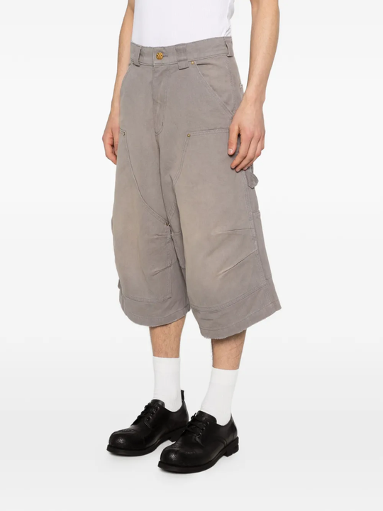 Grey shorts worn by a person, showing the shorts' fit