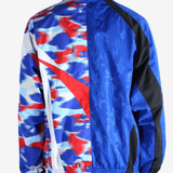 Blue jacket worn by a person,showing the jacket's fit