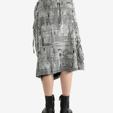 White skirts worn by a person, showing the skirts fit