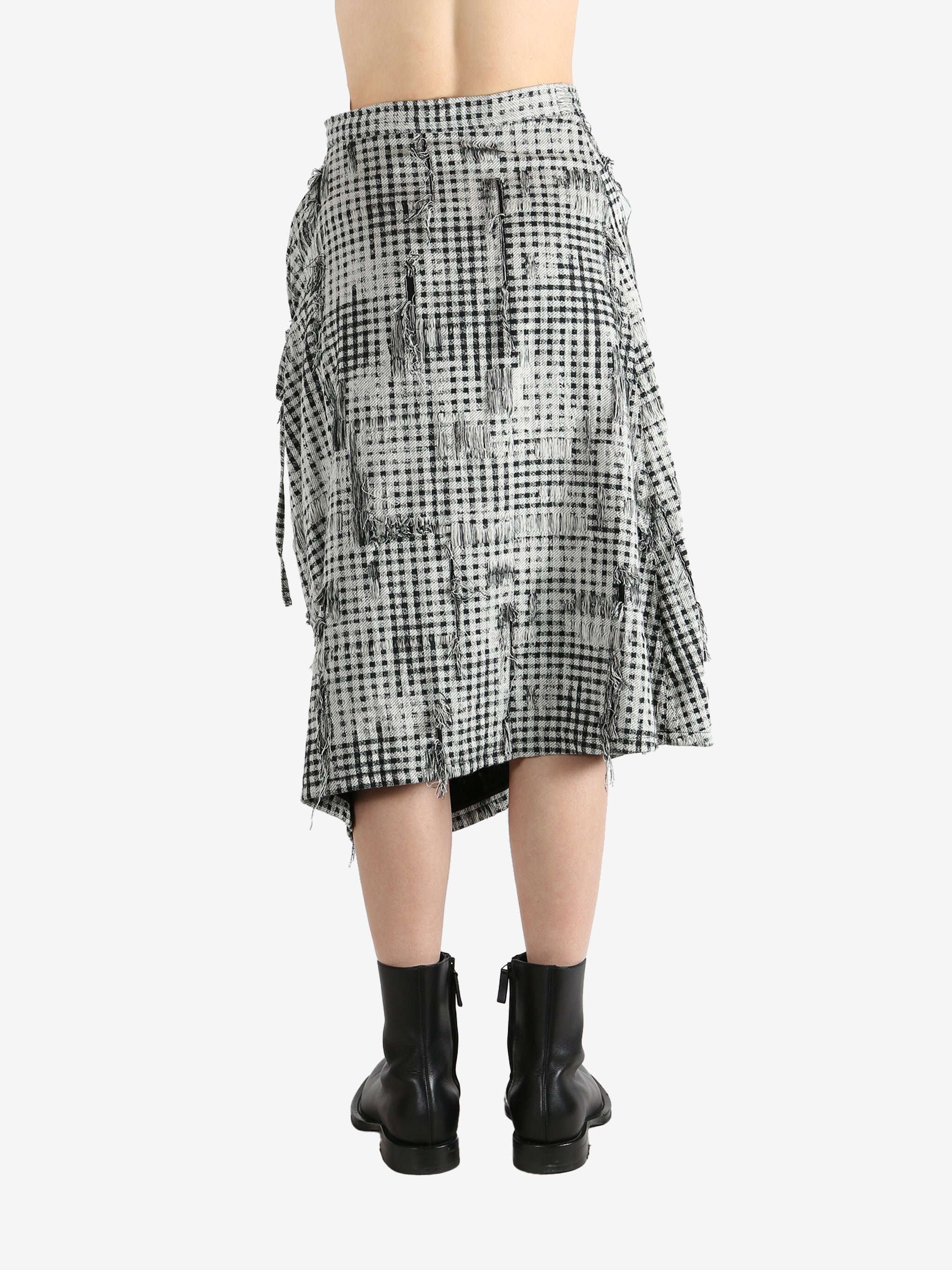 White skirts worn by a person, showing the skirts fit