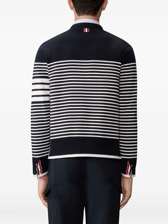 Black cardigan worn by a person, showing the cardigan fit