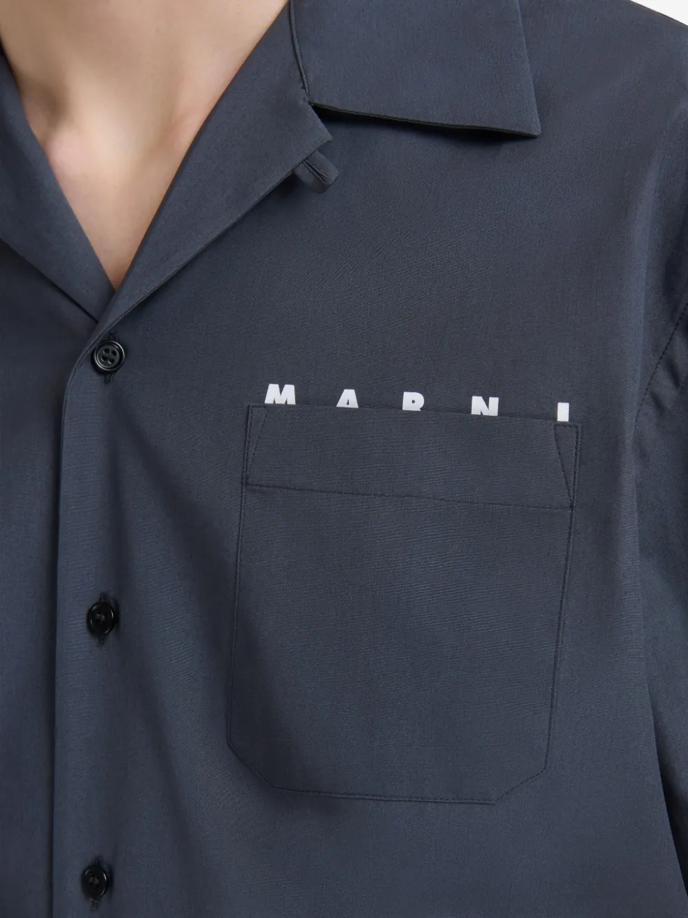 Close up of blue shirt showing texture of the cotton fabric