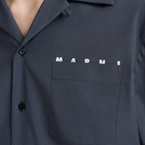 Close up of blue shirt showing texture of the cotton fabric