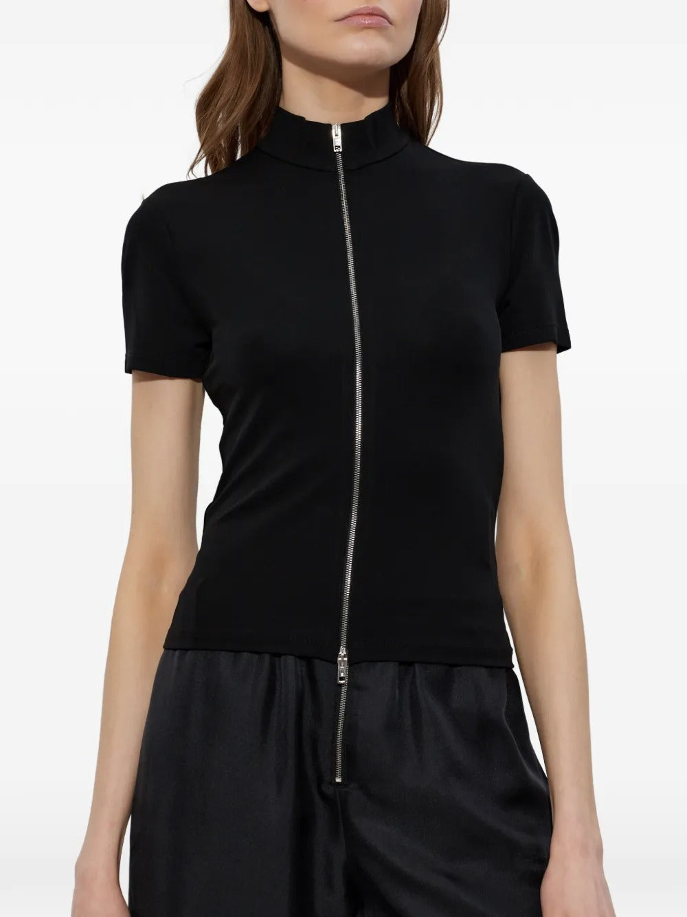 Black top worn by a person, showing the top's fit