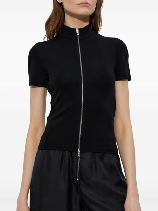 Black top worn by a person, showing the top's fit
