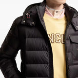 Black jacket worn by a person, showing the jacket fit
