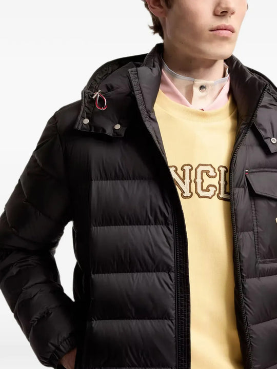 Black jacket worn by a person, showing the jacket fit