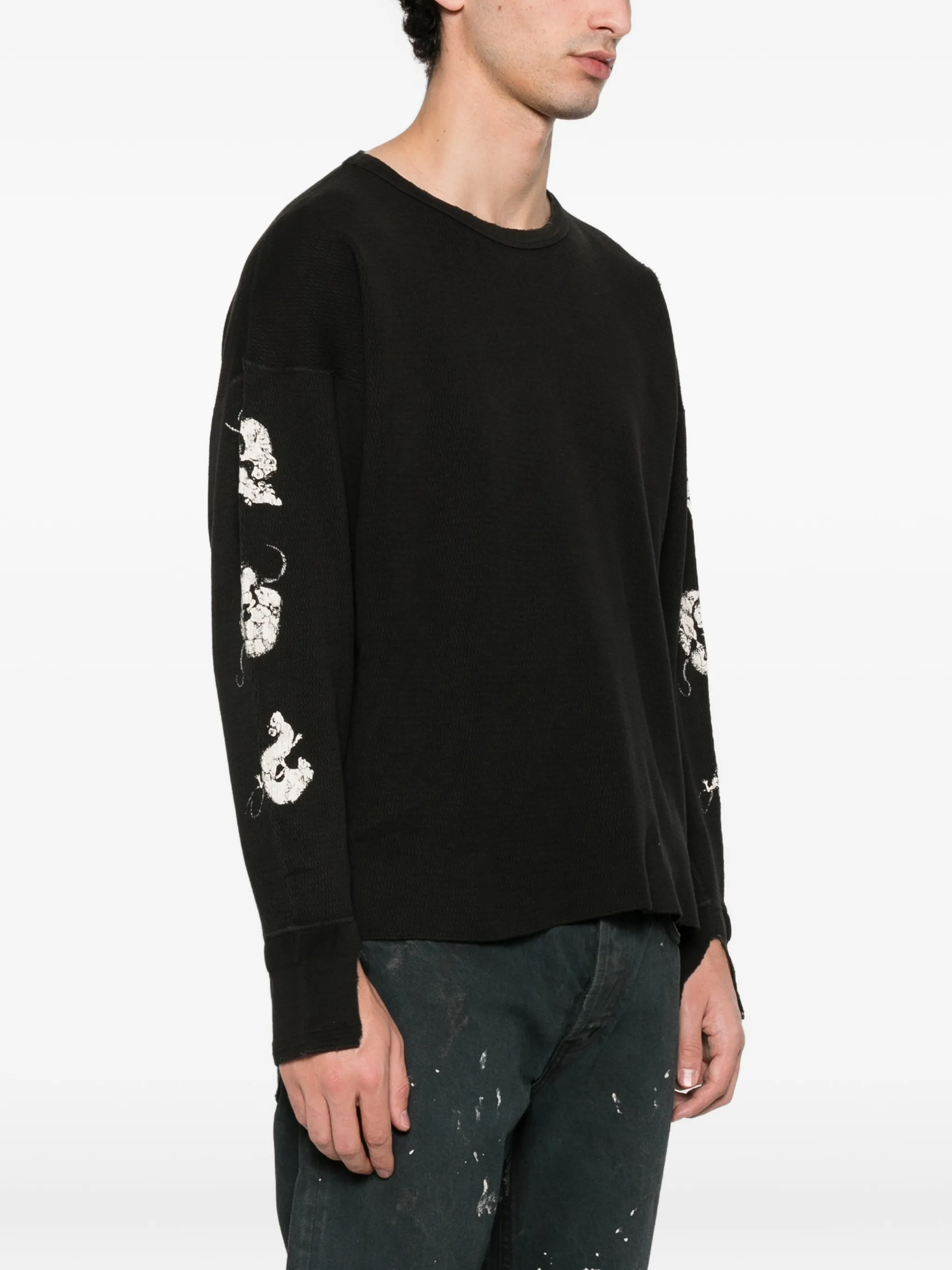 Black t-shirt worn by a person, showing the t-shirt's fit