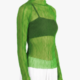 Green shirt worn by a person, showing the shirt fit