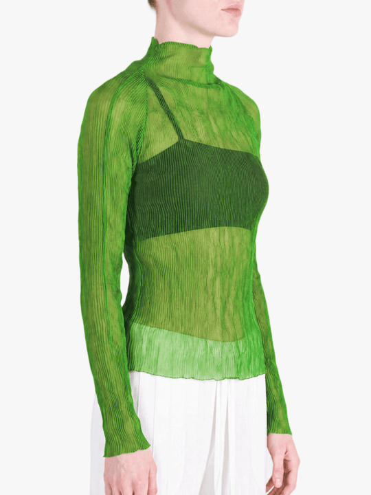 Green shirt worn by a person, showing the shirt fit
