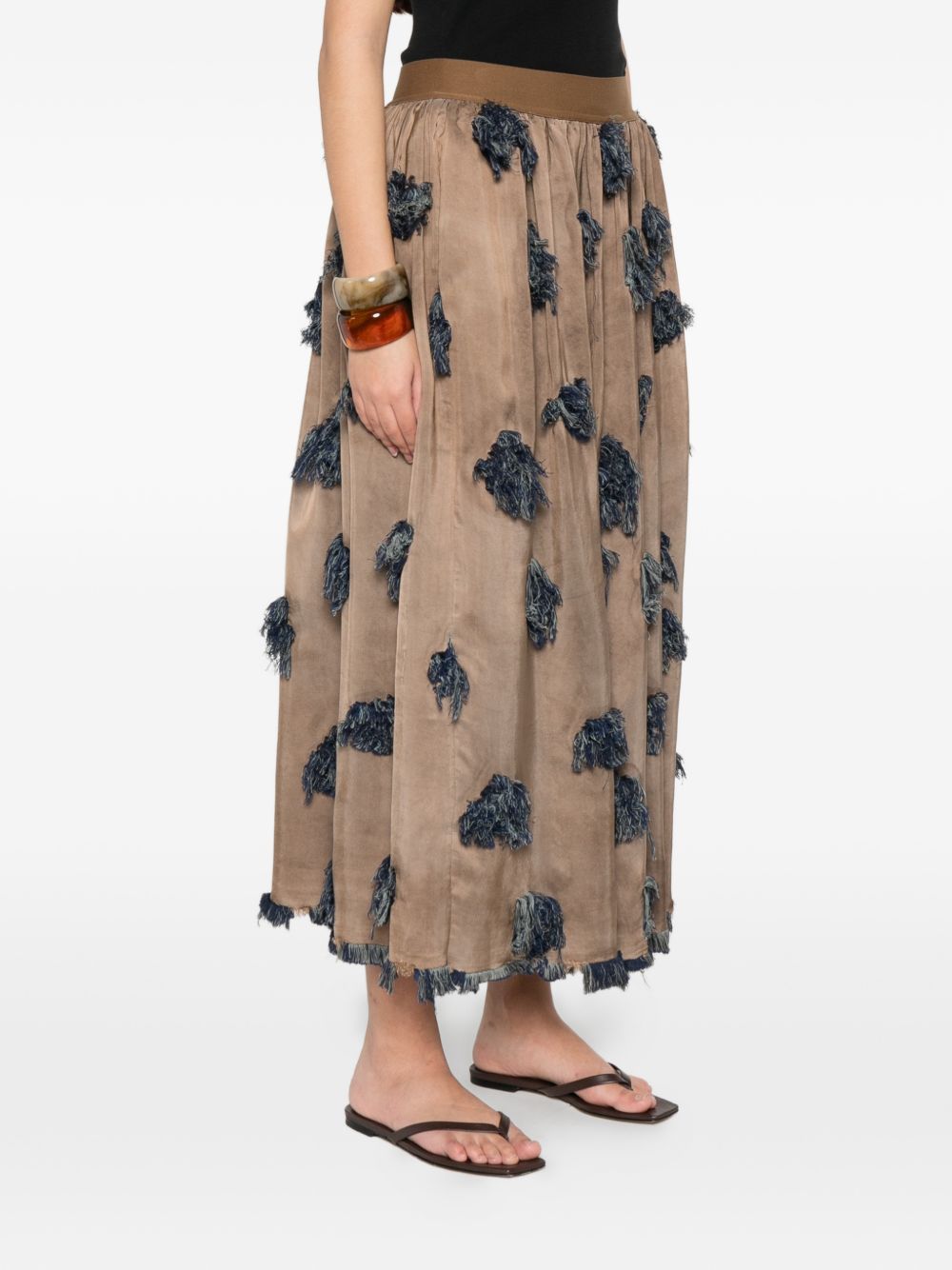 Brown skirt worn by a person, showing the skirt's fit