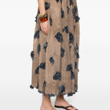 Brown skirt worn by a person, showing the skirt's fit