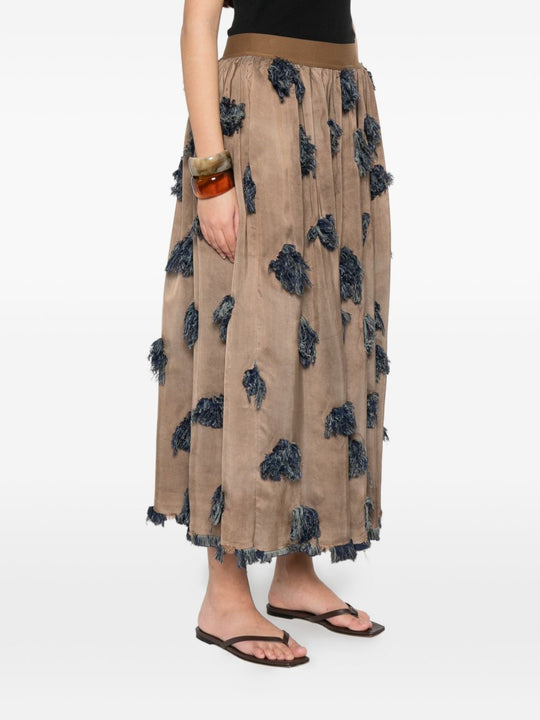 Brown skirt worn by a person, showing the skirt's fit