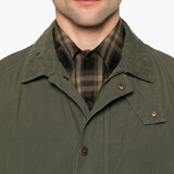 Close up of green jacket, showing texture of the cotton fabric