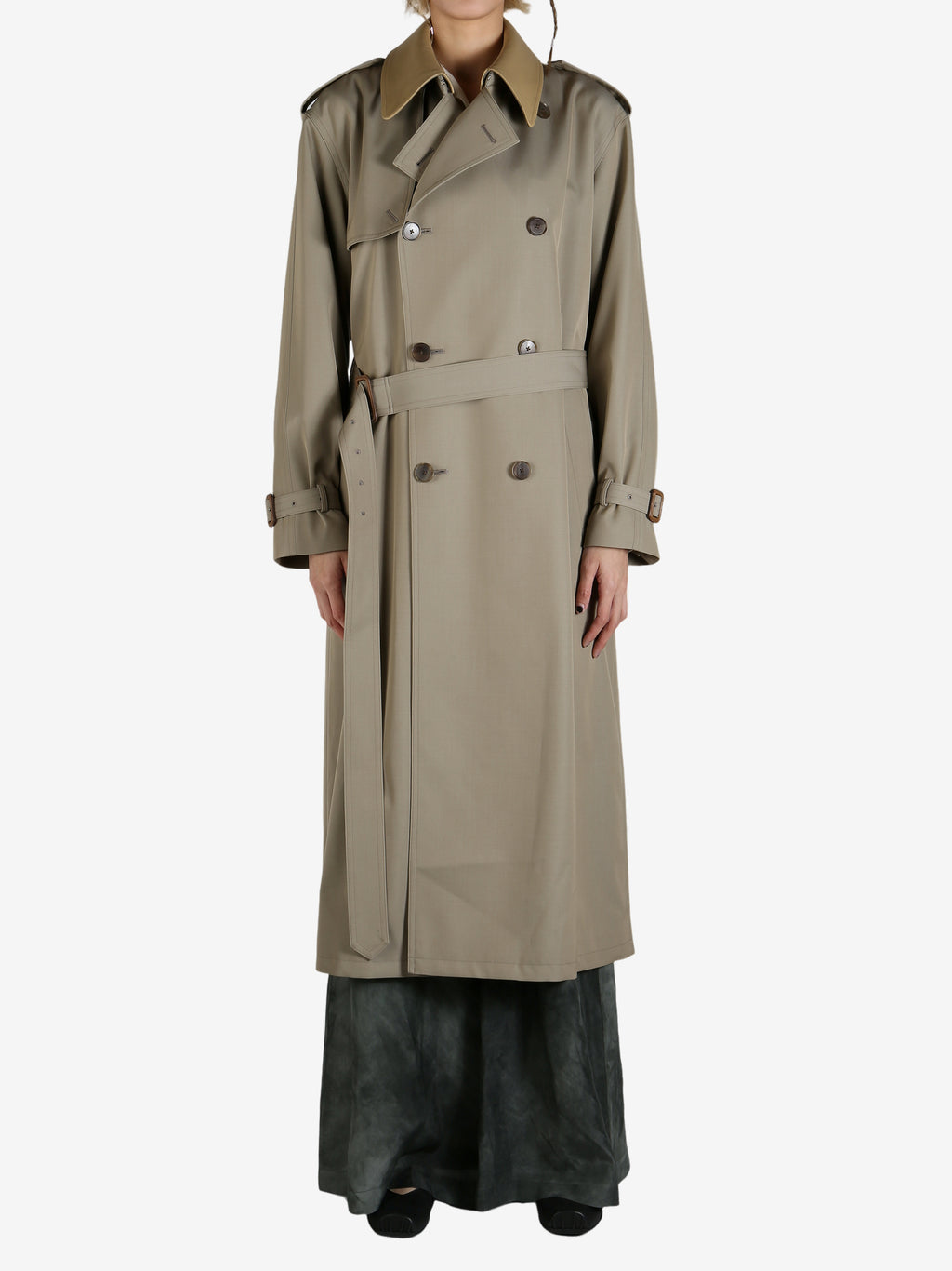 Tan coat worn by a person, showing the coat's fit