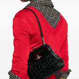 Black bag worn by a person, showing the black bag's fit