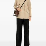 Brown bag worn by a person, showing the bag's fit