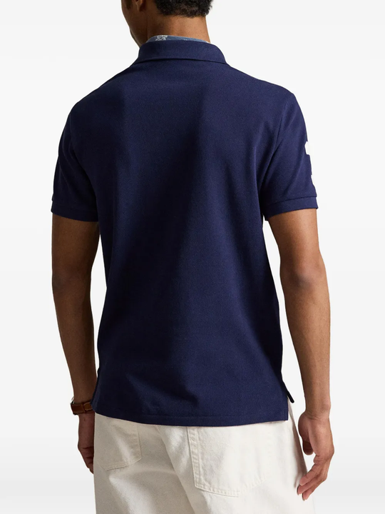 Blue shirt worn by a person, showing the shirt's fit