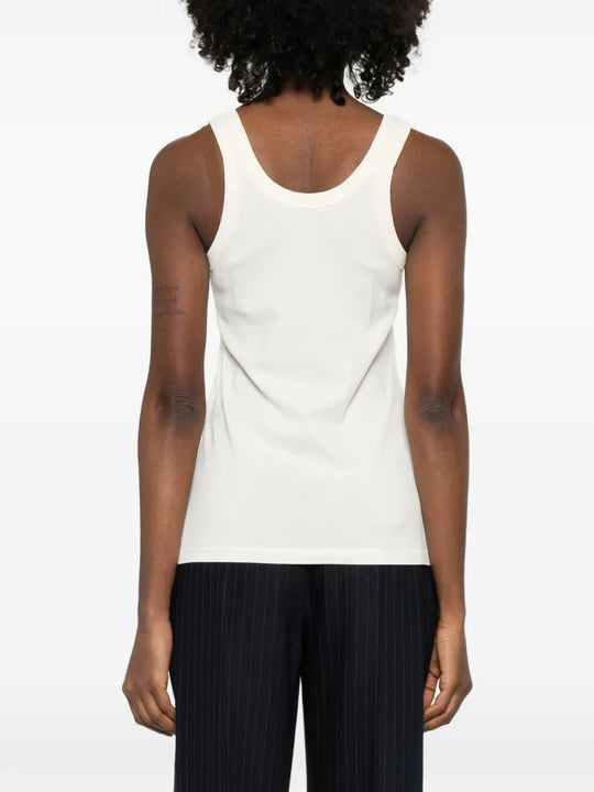 Tan top worn by a person, showing the top fit