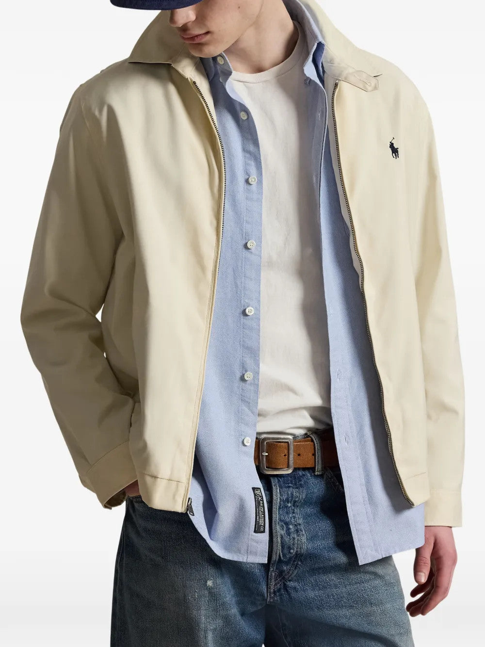 Tan jacket worn by a person, showing the jacket fit