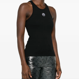 Black tops worn by a person, showing the tops' fit