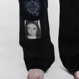 Black pants worn by a person, showing the pants fit