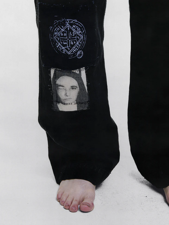 Black pants worn by a person, showing the pants fit