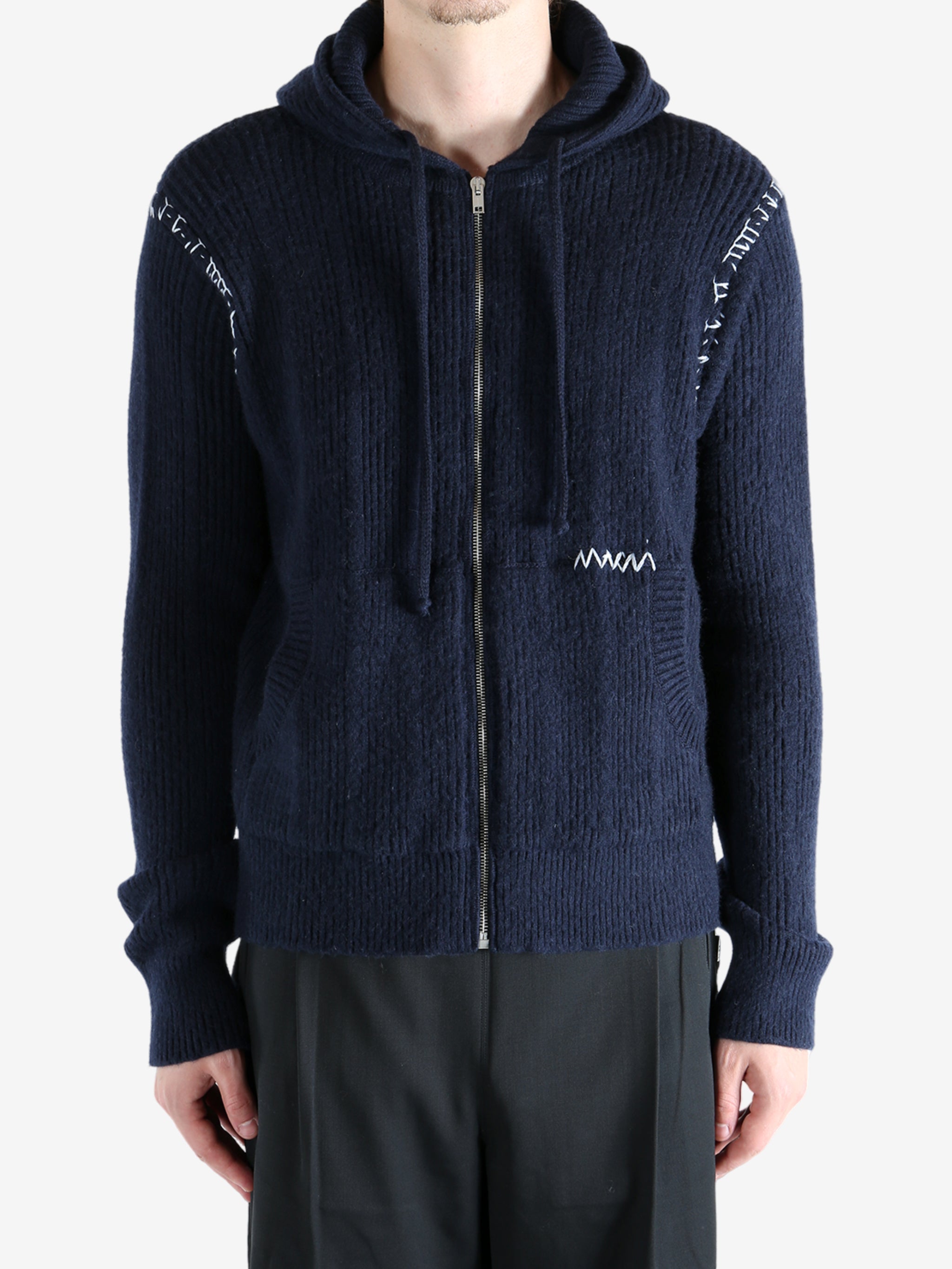 Navy cardigan worn by a person, showing the cardigan's fit