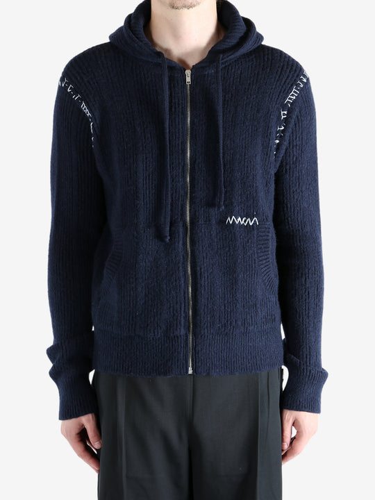 Navy cardigan worn by a person, showing the cardigan's fit