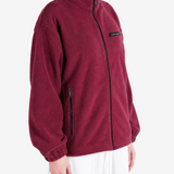 Burgundy jacket worn by a person, showing the jacket fit