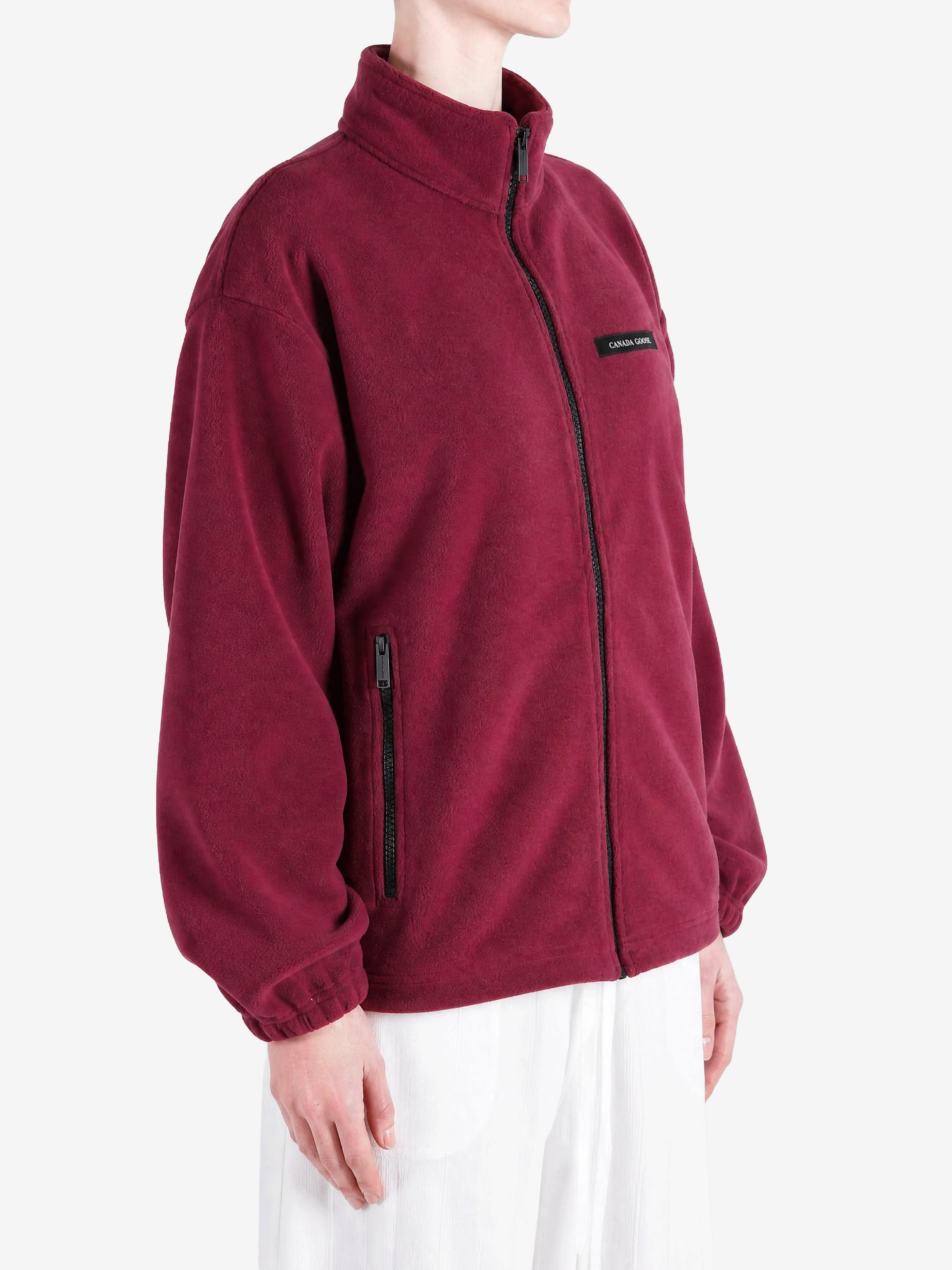 Burgundy jacket worn by a person, showing the jacket fit