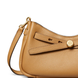 Close up of brown bag, showing texture of the leather fabric