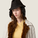 Yellow knitwear worn by a person, showing the knitwear fit