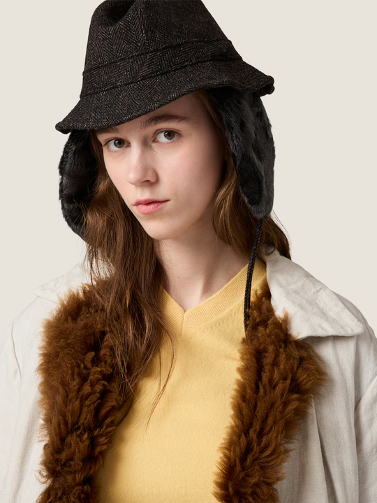 Yellow knitwear worn by a person, showing the knitwear fit