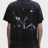 Black shirts worn by a person, showing the shirts fit