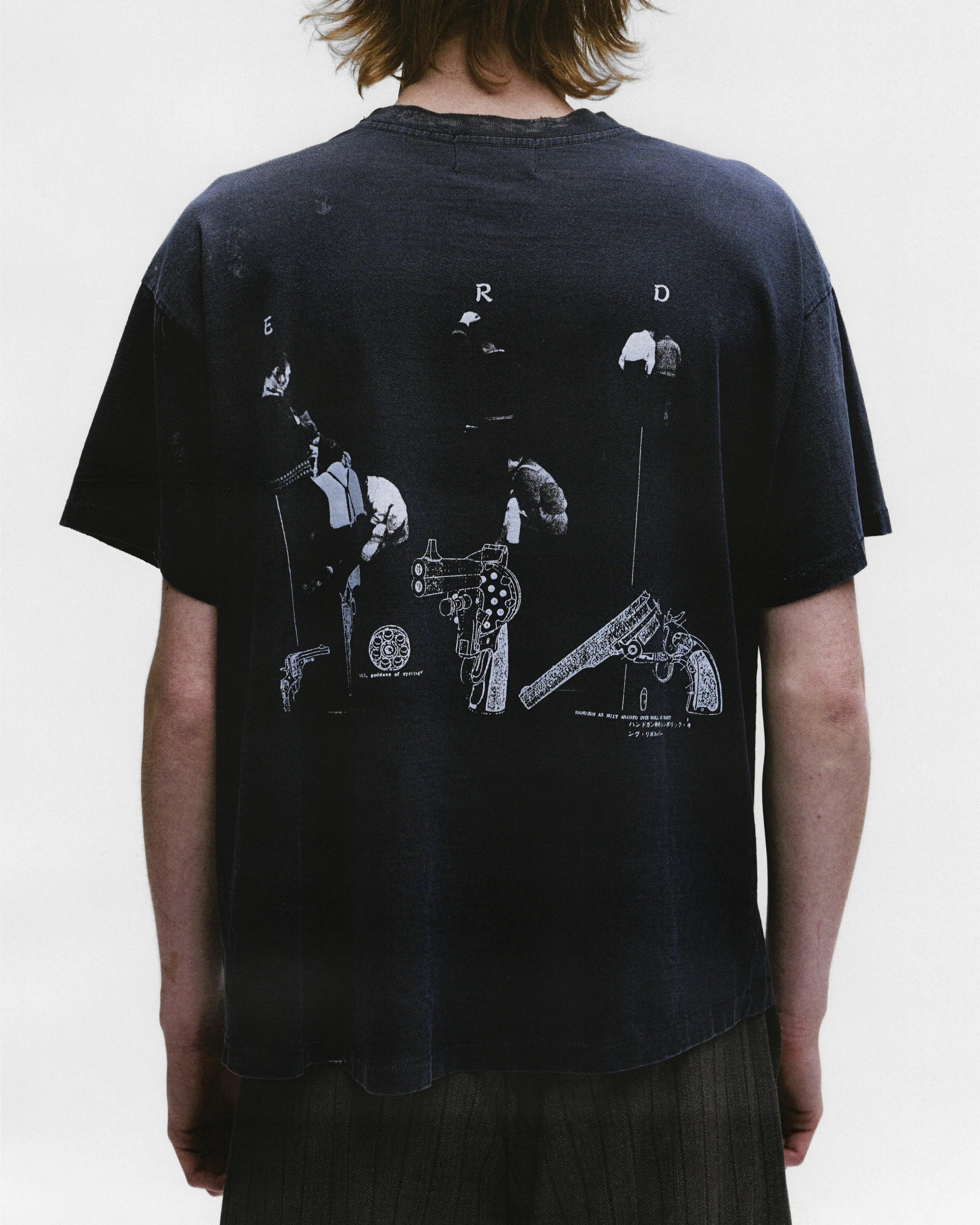 Black shirts worn by a person, showing the shirts fit