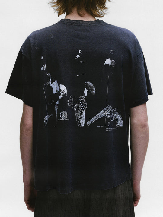 Black shirts worn by a person, showing the shirts fit