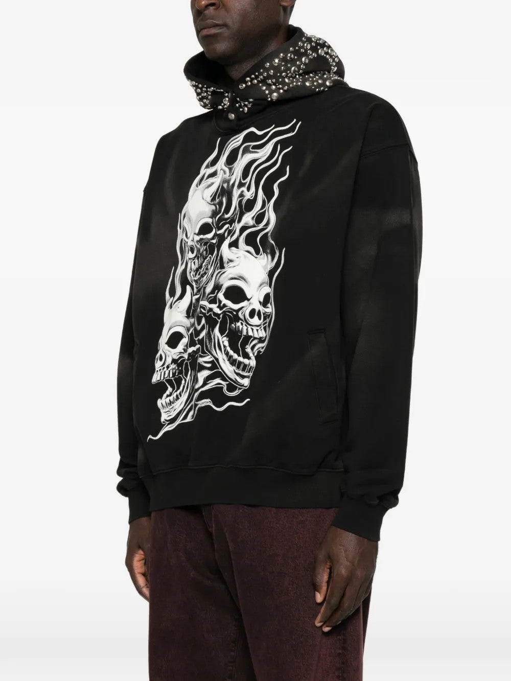 Black hoodie worn by a person, showing the hoodie fit
