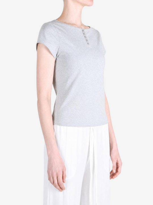 Grey shirt worn by a person, showing the shirt fit