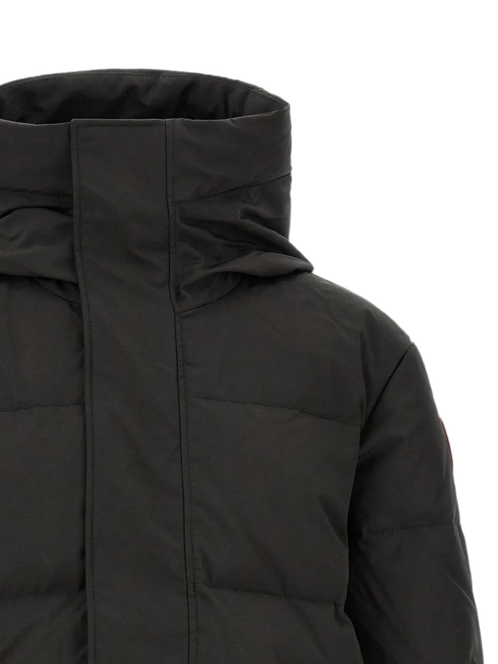 Close up of Black jacket, showing texture of the 84% recycled polyester/ 16% organic cotton made fabric
