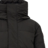 Close up of Black jacket, showing texture of the 84% recycled polyester/ 16% organic cotton made fabric